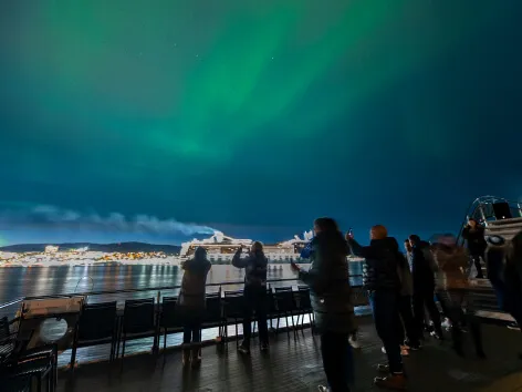 Northern lights seen from the seaside on a boat tour with Brim in Tromso