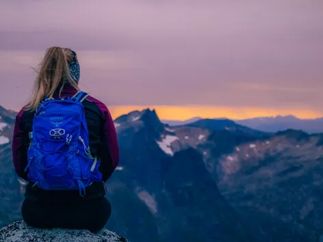 Girl enjoying view from a mountain in Tromso