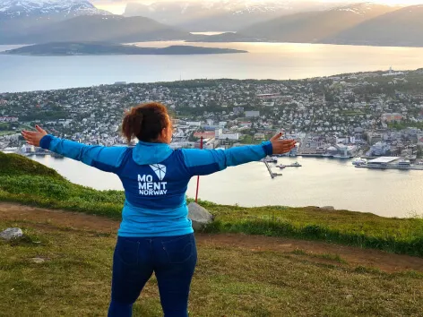 Lady enjoying the view of Tromsø from the mountain by the cable car