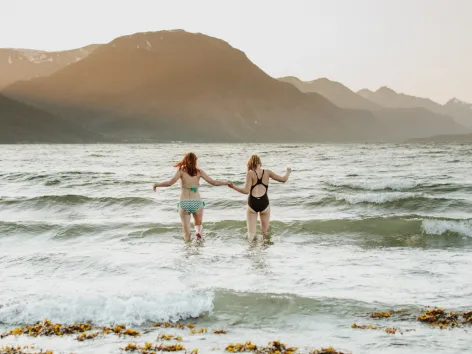 swim in the sea in summer with a view of the mountains