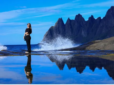 Guest looks out to sea from the Senja island