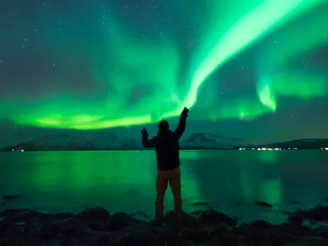 Man looking at the northern lights