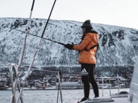 Woman fishing on a boat