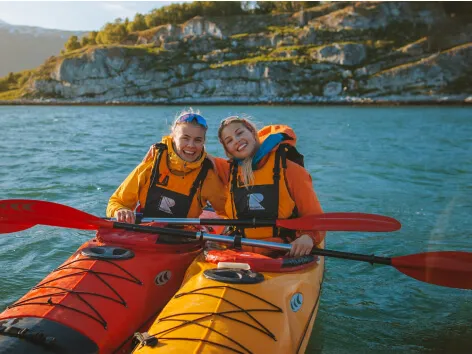 girls friends kayaking in autumn in Tromso