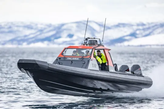 A RIB boat speeding on the water