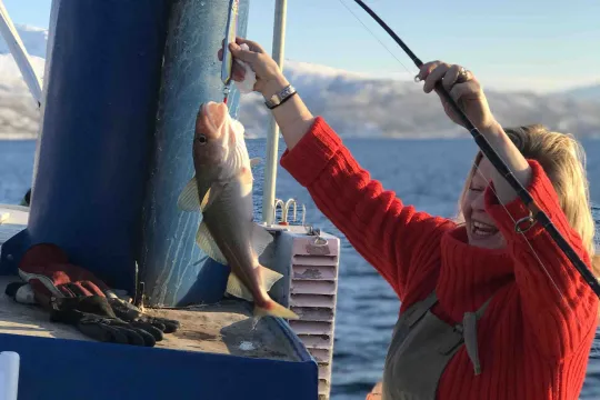 A woman has cathed a fish