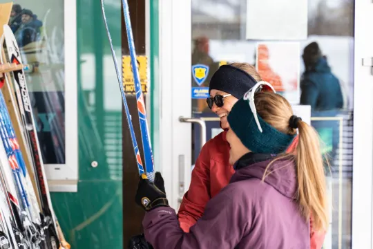 People holding skis.