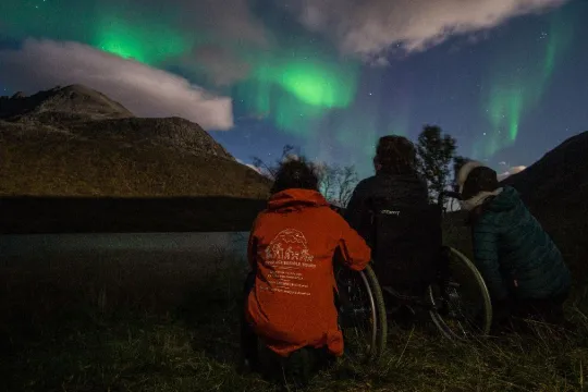 Three guest enjoying the northern lights