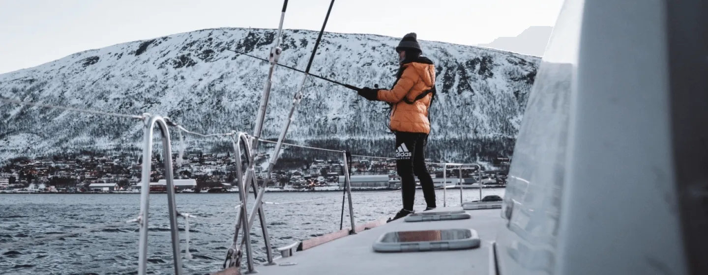 Woman fishing on a boat